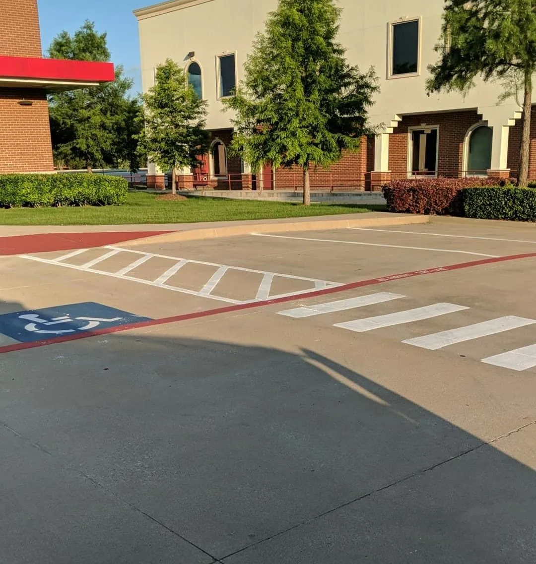 Fire lane marking on curb and pavement for improved emergency access